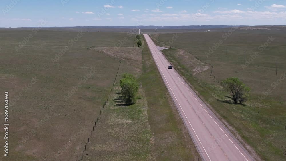 Lonely road in American Prairie Montana USA Lonely road in American Prairie Montana USA