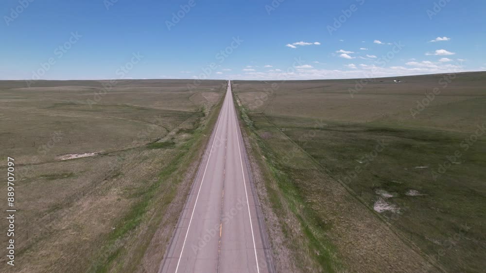 Lonely road in American Prairie Montana USA Lonely road in American Prairie Montana USA