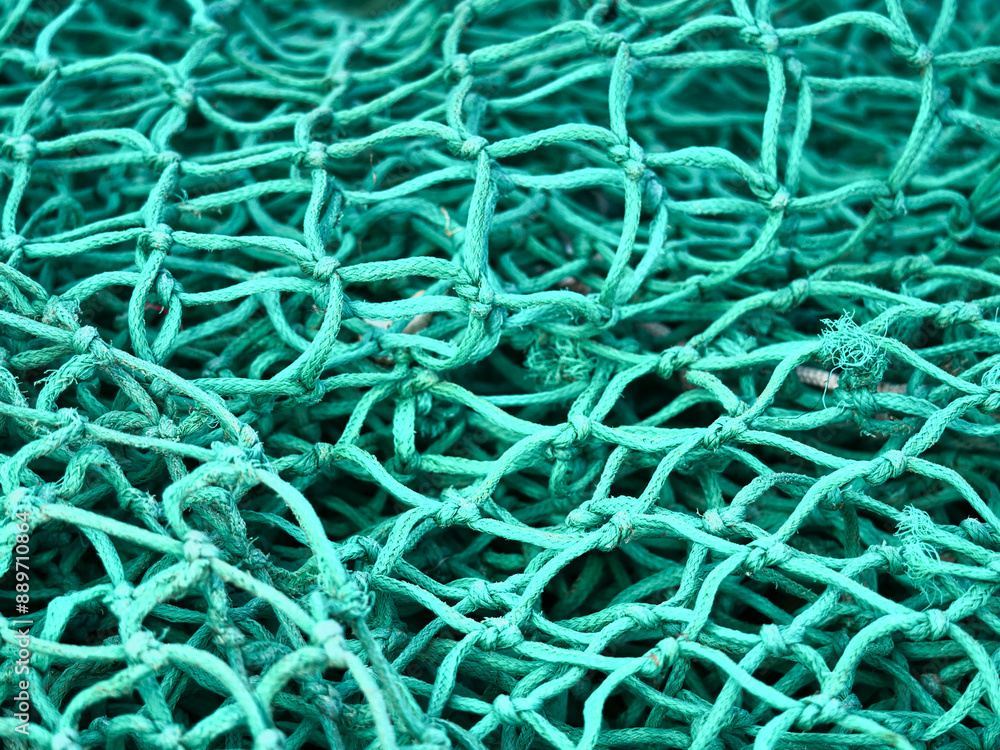 Nahaufnahme eines grünen Fischernetzes Nahaufnahme eines grünen Fischernetzes
