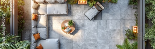 A Top View of a Secluded Patio With a Grey Sofa and Lush Greenery