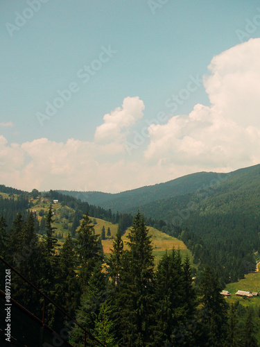 Beautiful green mountains with cloudy sky background. Summer vacation. Mountain landscape. photo