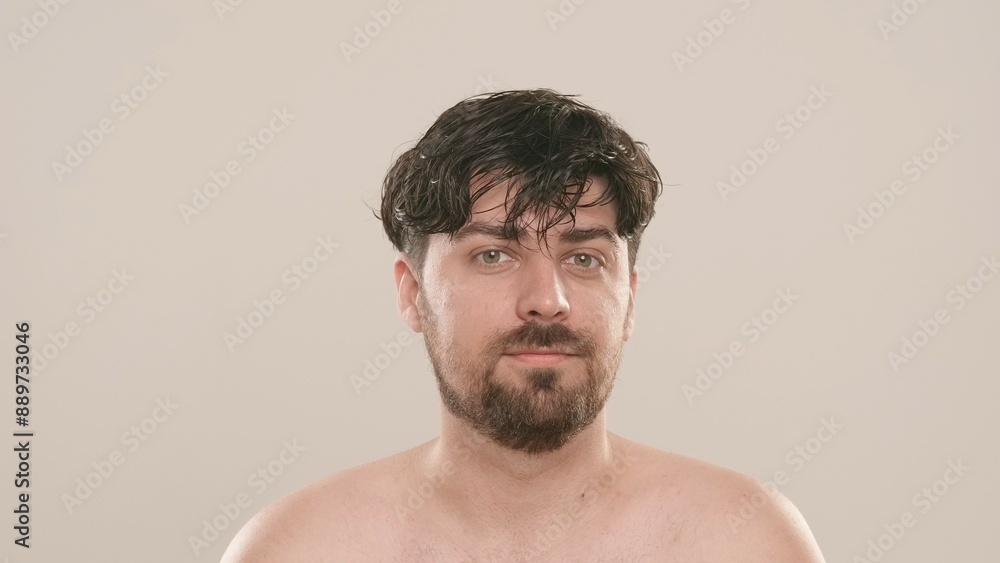 Obraz premium Young adult man looking at camera smiling, isolated on white background, close up shot. Natural beauty skin care concept.
