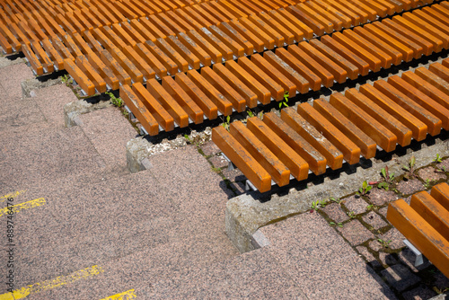 Obraz na płótnie Brown wooden benches in the city amphitheater. Close up of the rungs. Urban public spaces in the service of culture w salonie