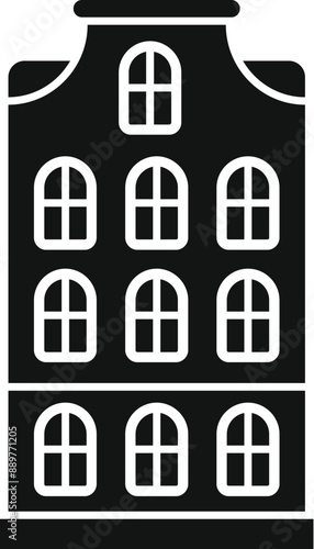 Classic dutch canal house facade with multiple windows and a traditional gable roofline