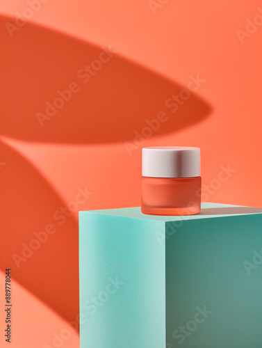 A Glass Skincare Facial Cream Jar Mockup Displayed on a Teal Green Podium Against A Vibrant Orange Color Background. Geometric and Minimal. Cosmetic Beauty Product Branding.