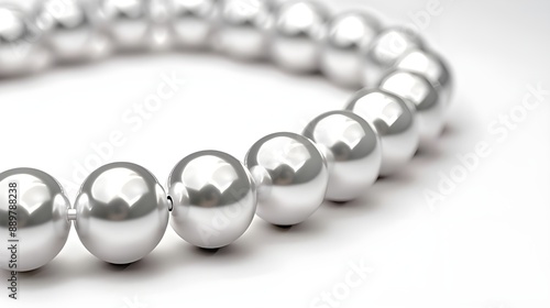 A sleek pearl bracelet featuring lustrous white pearls strung together elegantly
