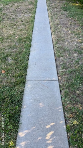 Wallpaper Mural narrow cement footpath across a grassy lawn at the park Torontodigital.ca