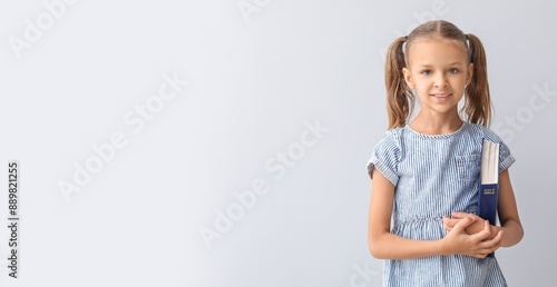 Cute little girl with Bible...