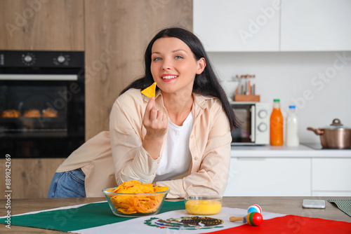 Young Mexican woman eating ...