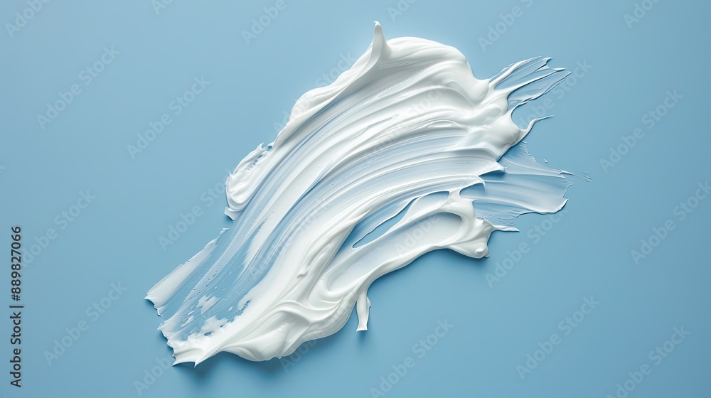 Smooth and rich cosmetic cream smears on a blue background, perfect for beauty and skincare promotions Smooth and rich cosmetic cream smears on a blue background, perfect for beauty and skincare promotions