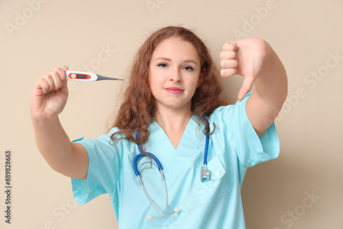 Female doctor with thermome...
