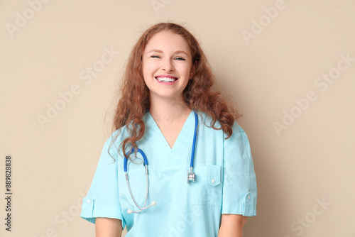Female doctor smiling on be...