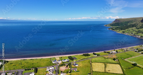 Aerial View of Glenariff Glen at Waterfoot Village on the Irish Sea Co Antrim Northern Ireland on sunny day with a blue sky photo