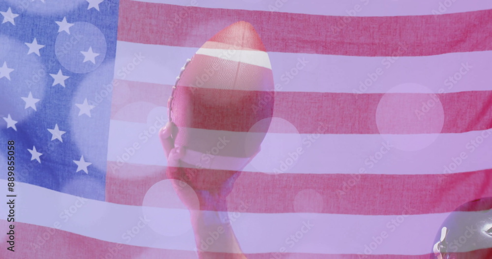 Naklejka premium Image of caucasian american football player holding ball and flag of usa
