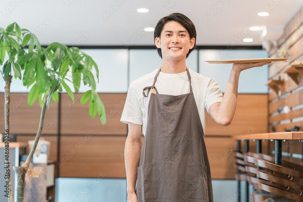 カフェ・飲食店で働くトレーを持つウェイター・カフェ店員・バリスタ・ホールスタッフ
カフェ・飲食店で働くトレーを持つウェイター・カフェ店員・バリスタ・ホールスタッフ