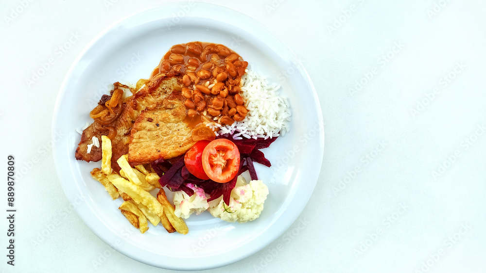 Traditional brazilian meal known as prato feito on the white background with copy space.
Traditional brazilian meal known as prato feito on the white background with copy space.