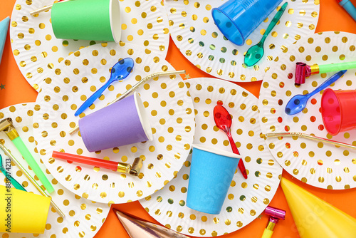 Photography Composition with paper tableware and decor for birthday party on color backgroun