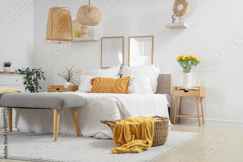 Interior of light bedroom w...
