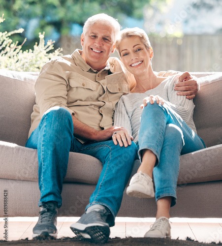 Mature, couple and relax with portrait on sofa with love or support, embrace and affection with care for bonding. Senior, man and woman on porch outdoor for lounge on retirement, happy and home.