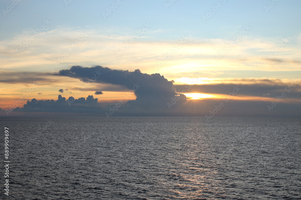 Fototapeta premium View Of Sunset Through Clouds In The Sea 