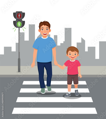 Cute little boy and his father crossing the road on zebra crossing