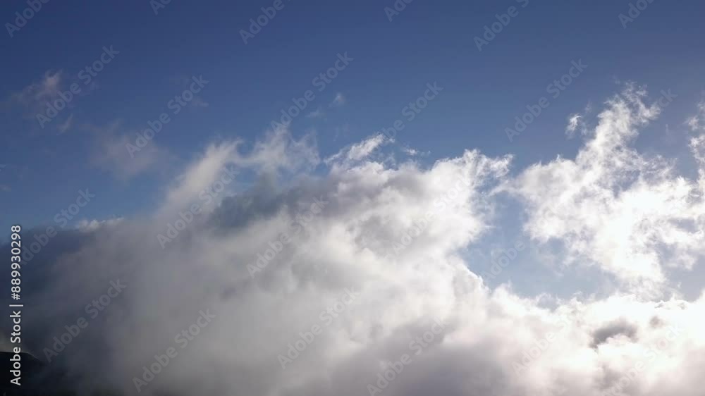 Daytime drone aerial of overlapping white clouds drifting in the blue sky over Haleakala, Maui Daytime drone aerial of overlapping white clouds drifting in the blue sky over Haleakala, Maui
