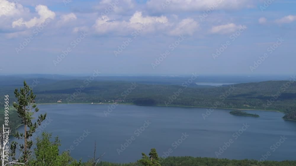 Aerial view of pine tree, beautiful blue lake, sky and green summer forest. Top view from mountain. Amazing landscape. Nature footage. Wonderful hiking in national park Aerial view of pine tree, beautiful blue lake, sky and green summer forest. Top view from mountain. Amazing landscape. Nature footage. Wonderful hiking in national park