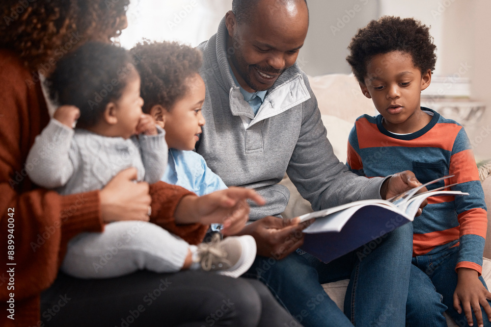 Black family, book and man reading on sofa for storytelling, comic or development at home. Parents, children or dad with old yearbook on couch for joke, history or showing kids memories with care Black family, book and man reading on sofa for storytelling, comic or development at home. Parents, children or dad with old yearbook on couch for joke, history or showing kids memories with care