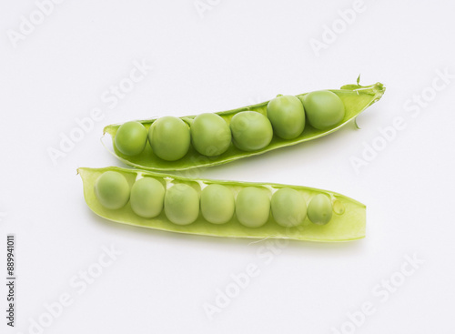 Close up of two green pea seeds with bean pod on white floor, South Korea
 photo