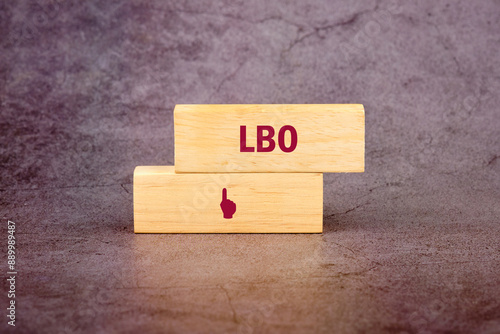 Leveraged Buyout LBO text on wooden blocks on an abstract background photo