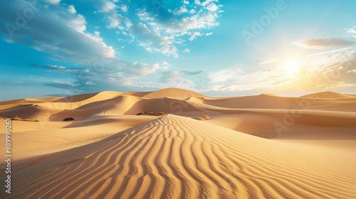 A vast desert landscape with rolling sand dunes and a bright, clear sky, showcasing nature's raw beauty