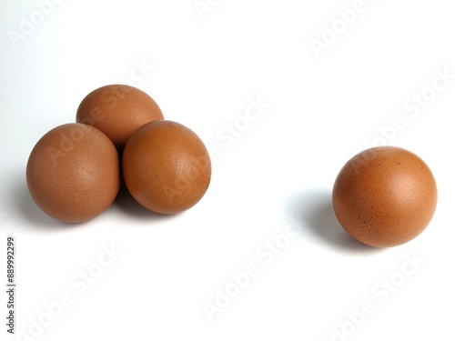 Brown chicken eggs isolated against white background