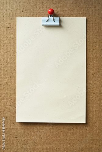 Blank sheet of paper on a bulletin board photo