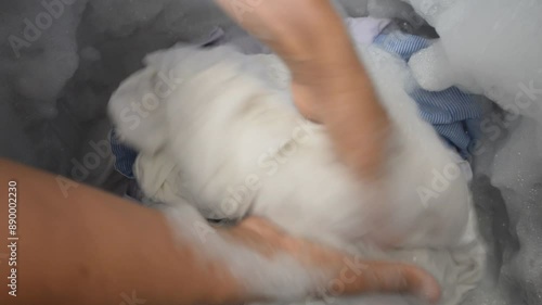 Traditional cleaning methods that have been around for a long time People washing clothes by hand Makes colorful clothes look new and fresh for longer.