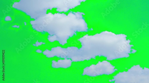 The green screen of moving white clouds with 4K resolution. Can use to change the background color.	