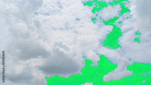 The green screen of moving white clouds with 4K resolution. Can use to change the background color.	
