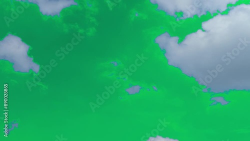 The green screen of moving white clouds with 4K resolution. Can use to change the background color.	