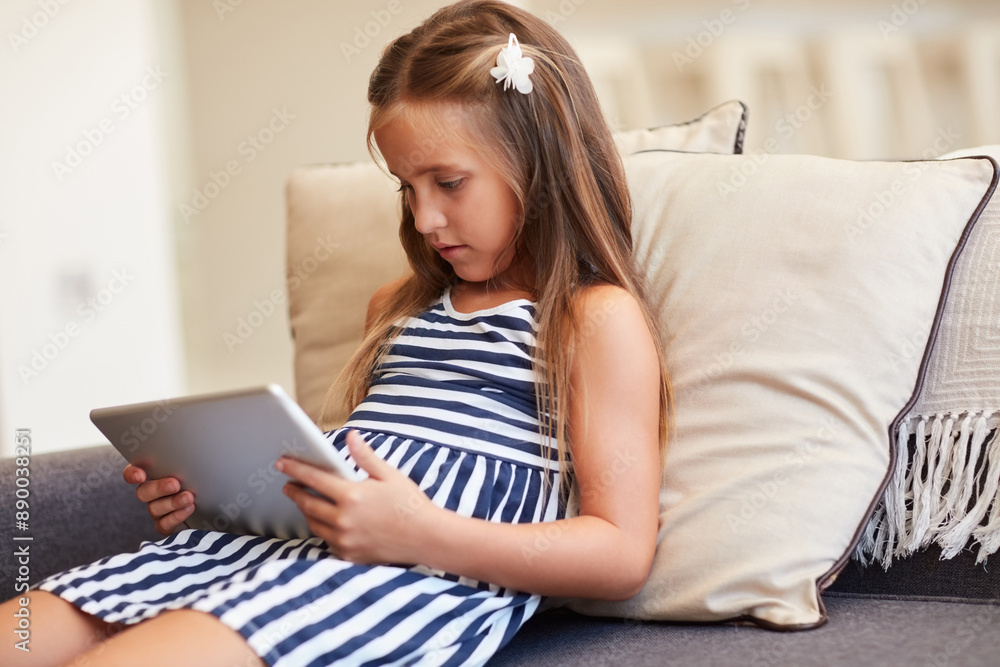 Girl, child and relax with tablet on sofa for online streaming, games and watching educational videos at home. Yong kid on couch on digital technology, web or app for reading ebook or e learning Girl, child and relax with tablet on sofa for online streaming, games and watching educational videos at home. Yong kid on couch on digital technology, web or app for reading ebook or e learning