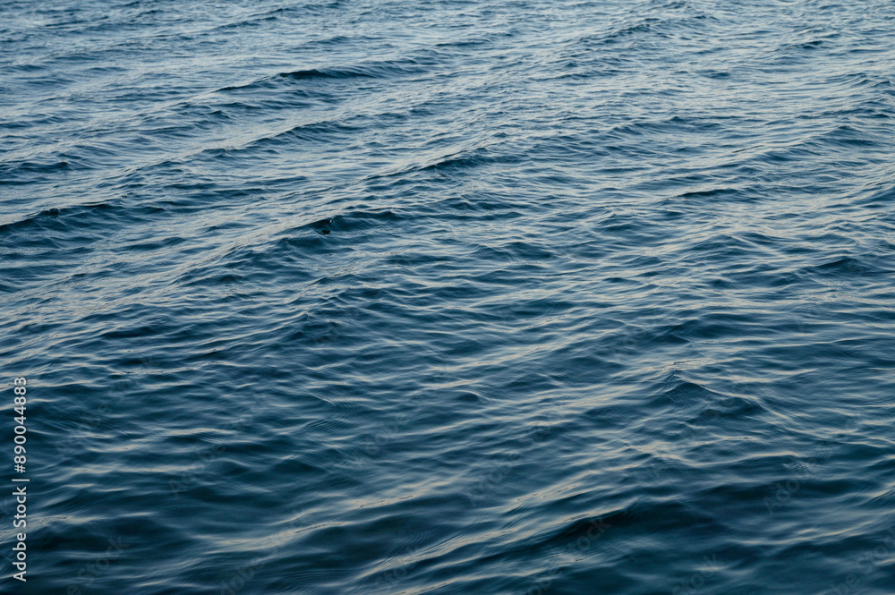 Transparent blue clear water surface texture with ripples, splashes and bubbles Transparent blue clear water surface texture with ripples, splashes and bubbles