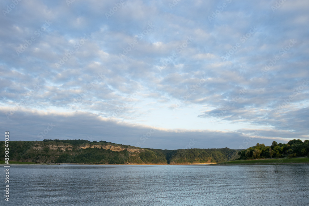 Cloudy sky over the Dniester River in the evening Cloudy sky over the Dniester River in the evening