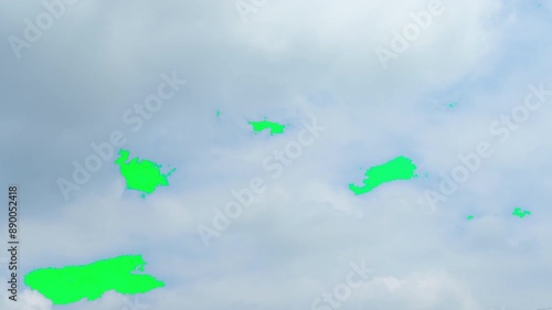 The green screen of moving white clouds with 4K resolution. Can use to change the background color.	