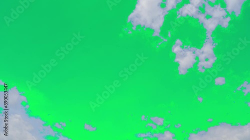 The green screen of moving white clouds with 4K resolution. Can use to change the background color.	