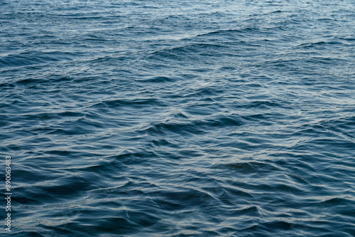 An abstract background of seawater flow under light exposure