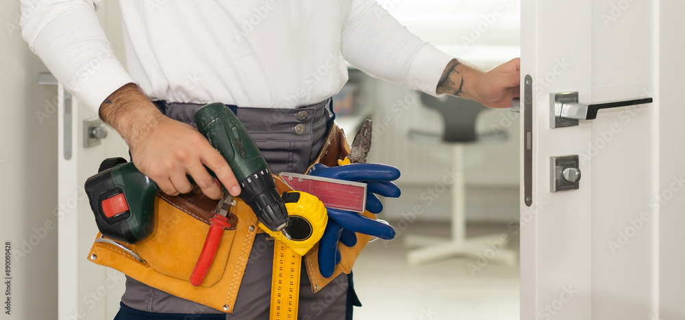 Handyman Fitting A New Door Using A Screwdriver At Home Handyman Fitting A New Door Using A Screwdriver At Home
