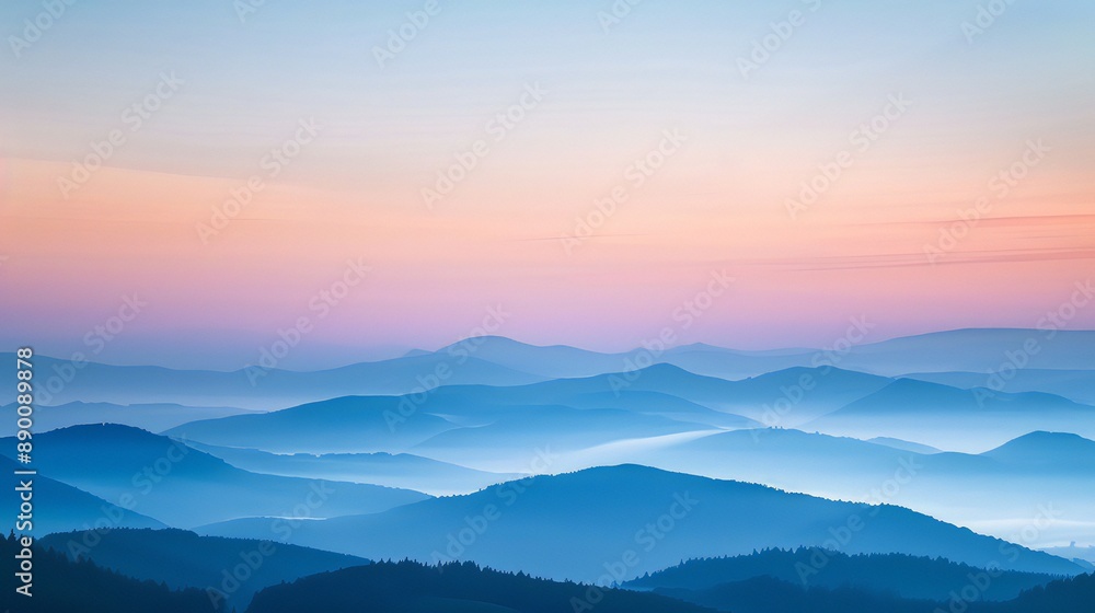 A serene landscape shot of mountains at dawn A serene landscape shot of mountains at dawn