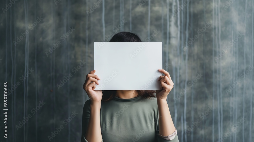 The woman holding blank sign over head The woman holding blank sign over head