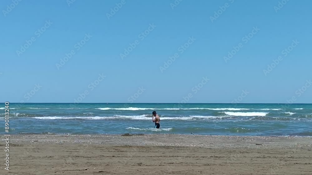 A 10-year-old boy swims in the sea A 10-year-old boy swims in the sea