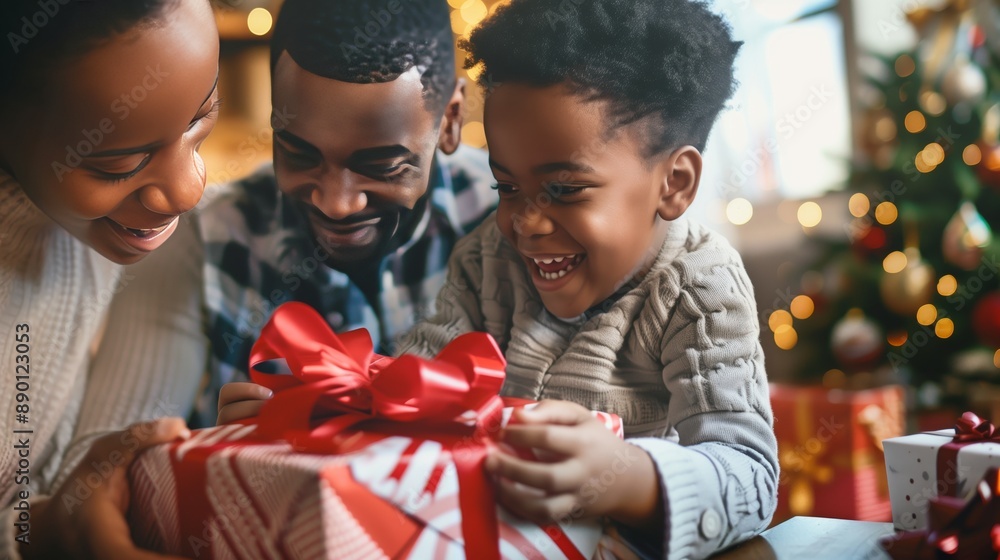 A family joyfully unwraps gifts around the Christmas tree, creating cherished memories together. A family joyfully unwraps gifts around the Christmas tree, creating cherished memories together.