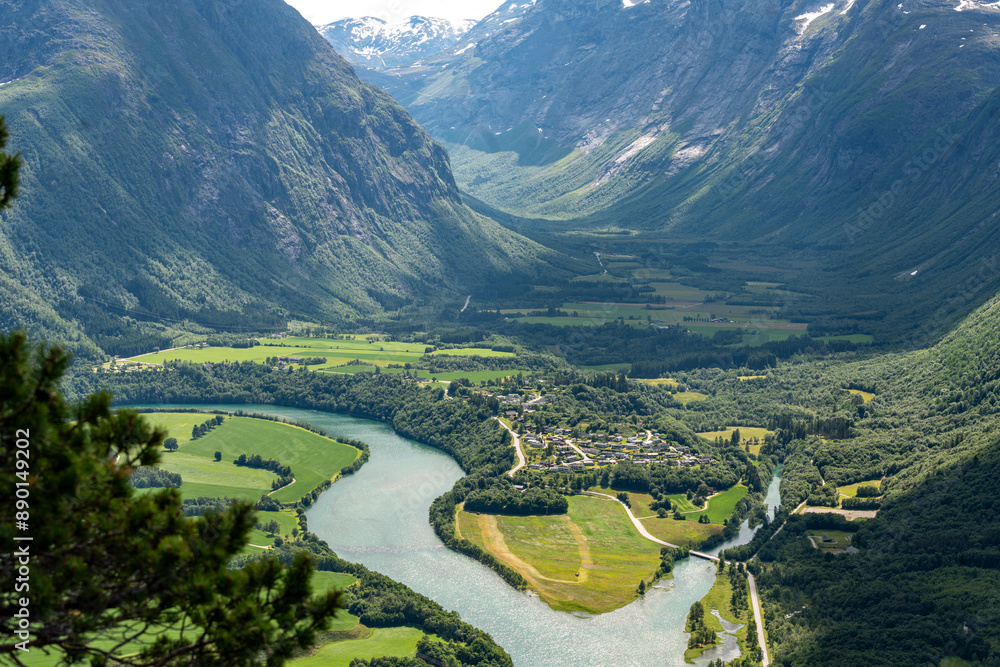view from above over Andalsnes in Rauma in Norway on fjord valley on a sunny summer day with mountains in the background view from above over Andalsnes in Rauma in Norway on fjord valley on a sunny summer day with mountains in the background