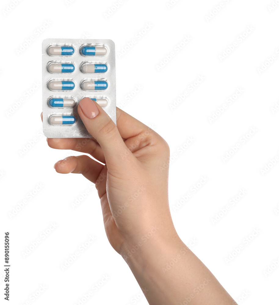 Fototapeta premium Woman with antibiotic pills on white background, closeup